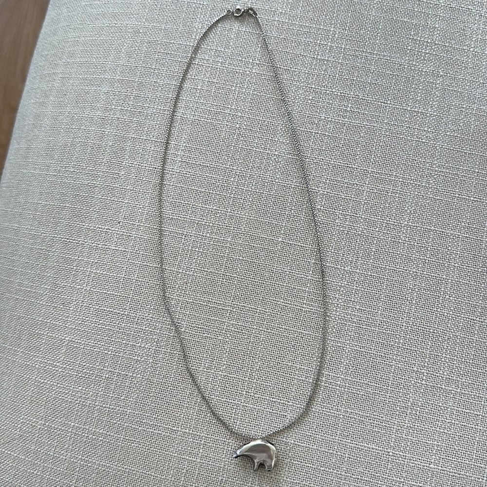 Silver polar bear on a silver beautiful necklace.